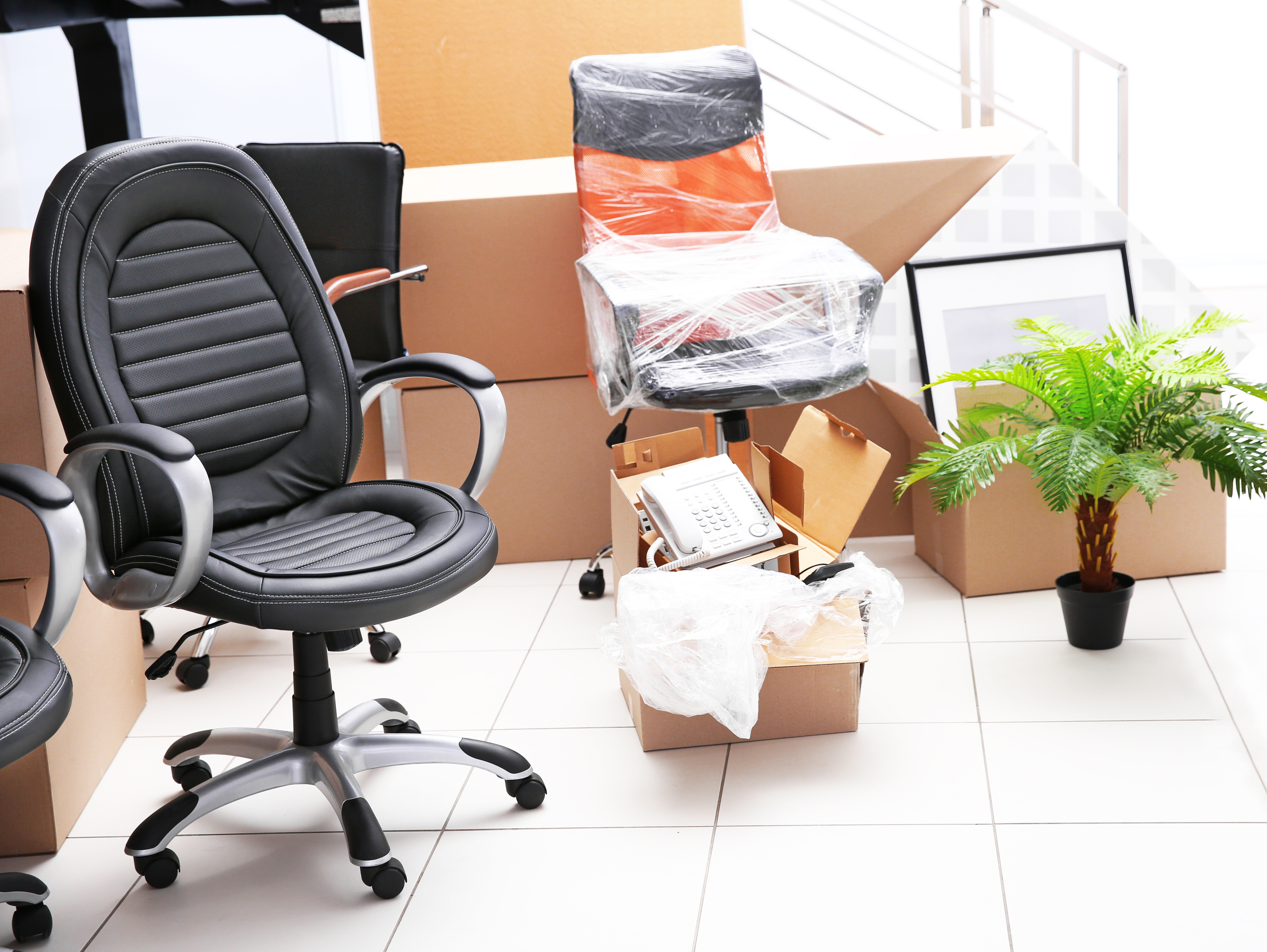 Move,concept.,unpacking,cardboard,boxes,in,a,new,office